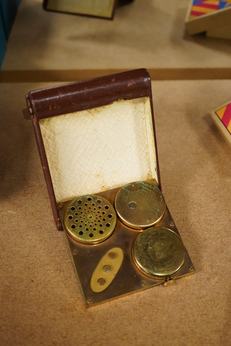 A mid-century Swiss leather cased travelling timepiece compendium with barometer, calendar and thermometer retailed by Ross, 10cm h